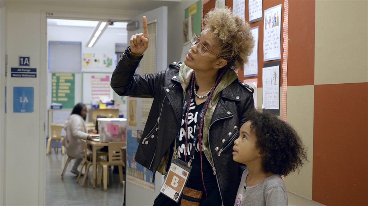 Woman explains something to a child