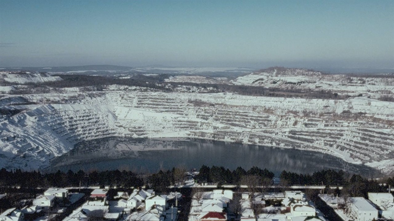 Snow covered landscape of houses and hills