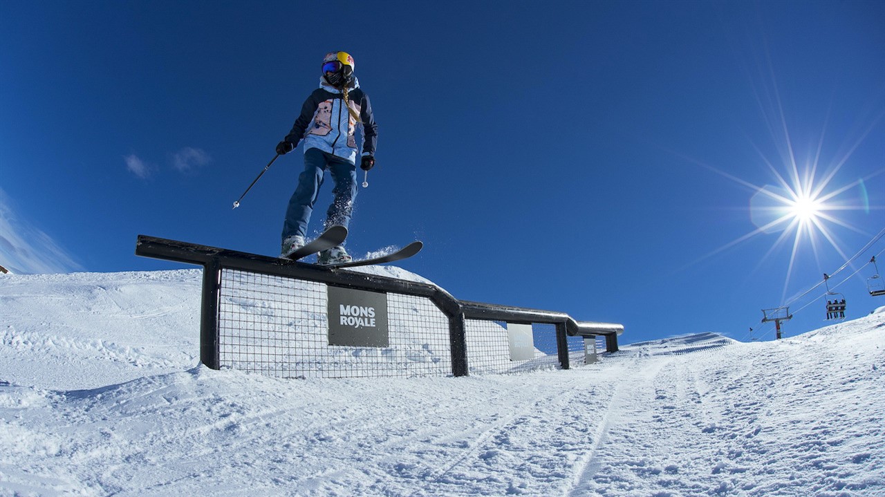 Skier pearched on a metal rail