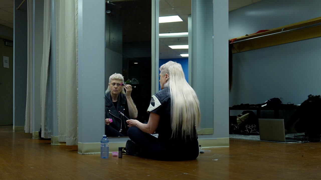 Peaches putting on makeup backstage