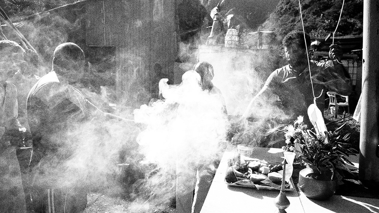 People engulfed in smoke