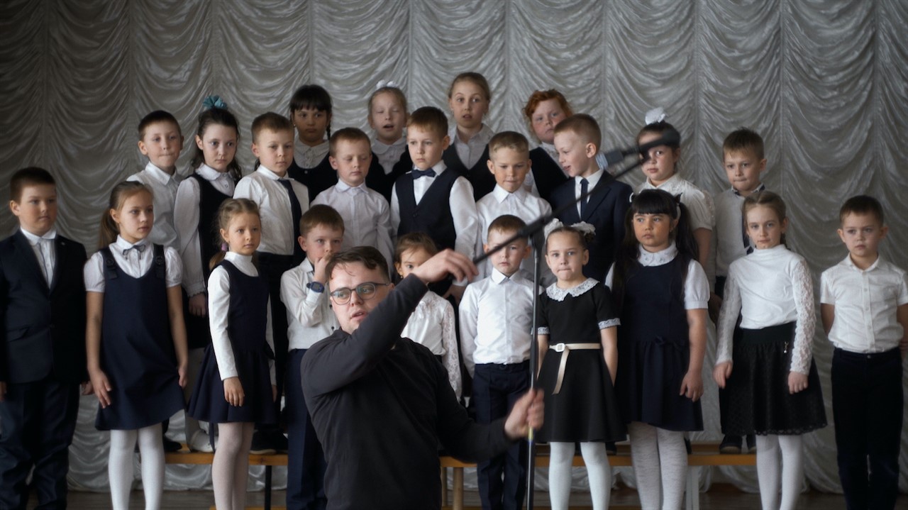 A group of elementry school children in formalwear
