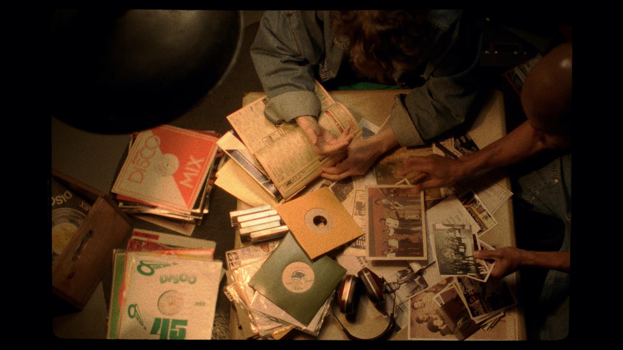 top view of a table with books, photos, records