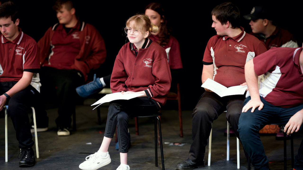 A group of seated teens